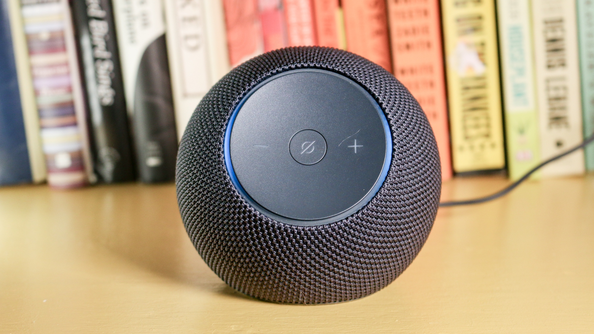 Echo Dot Max on a book shelf