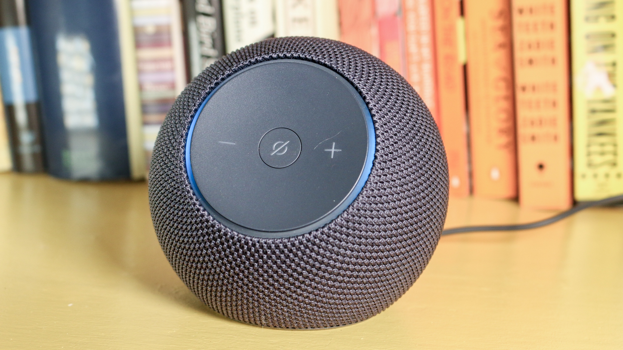 Echo Dot Max on a book shelf