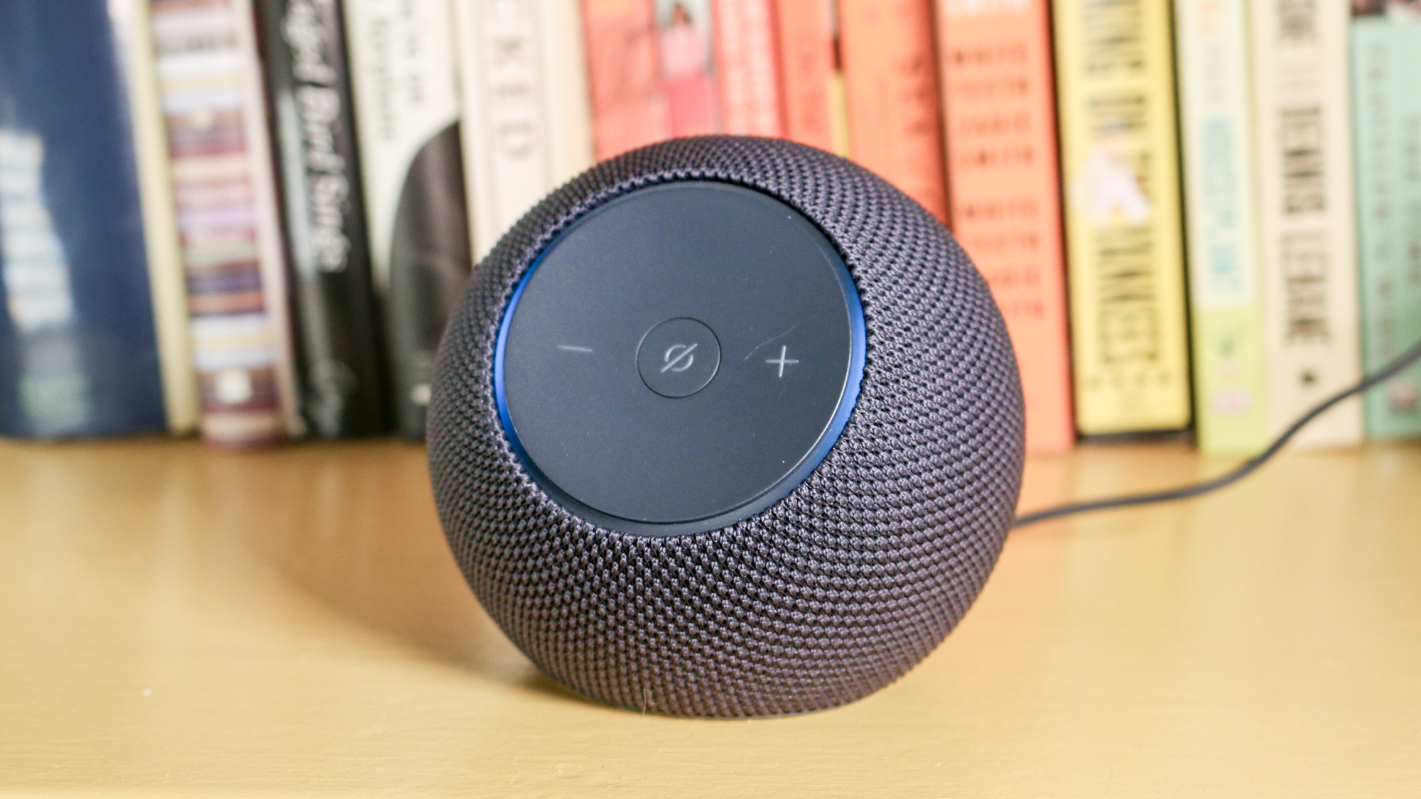 Echo Dot Max on a book shelf